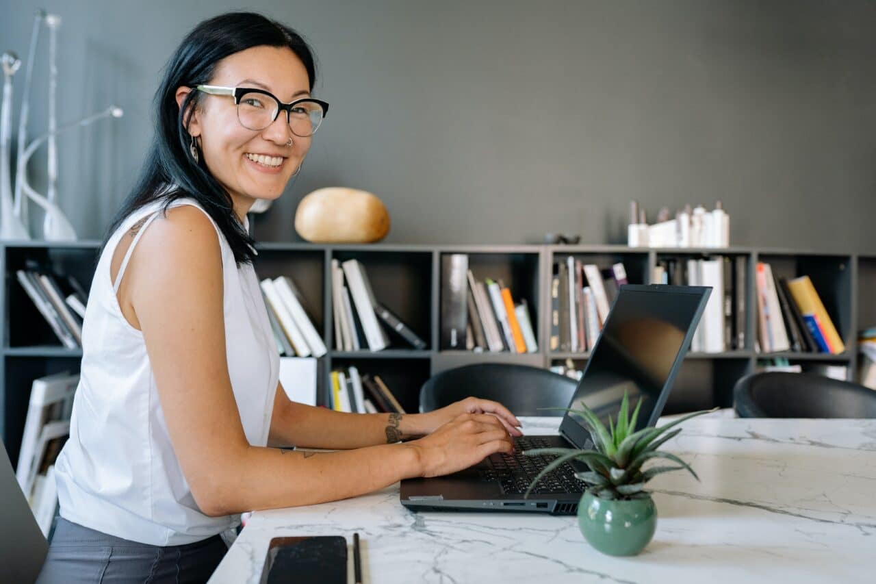 Woman using laptop to edit templates